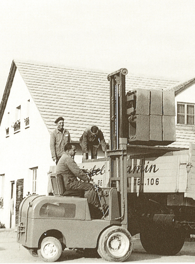 Employees loading a lorry