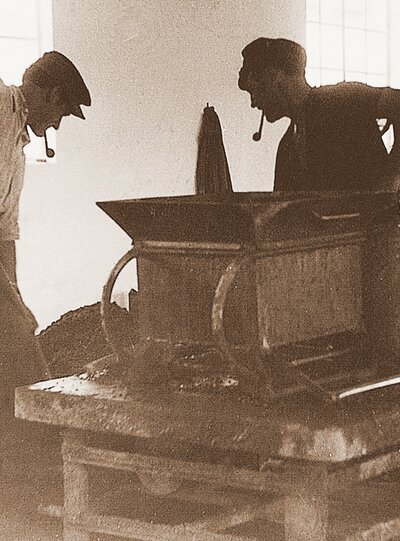 Employees at a vibratory plate