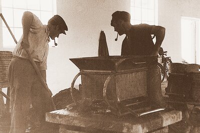 Employees at a vibratory plate