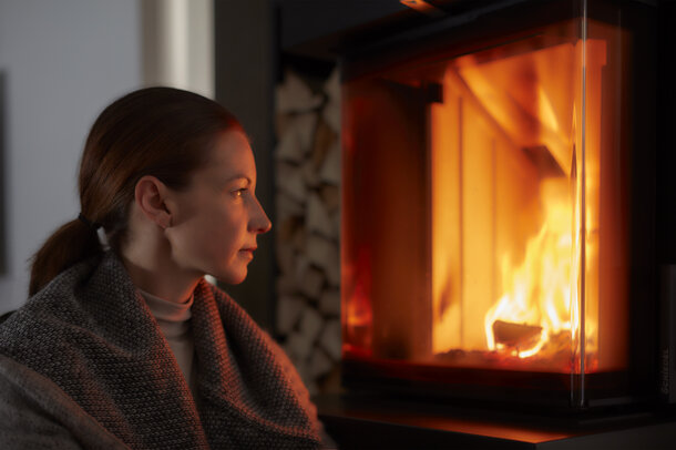 Woman in front of the fire