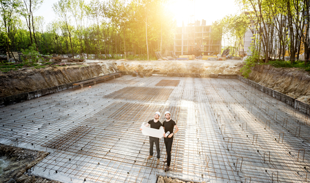 Architect and project manager standing on project site. | © AdobeStock 208121526